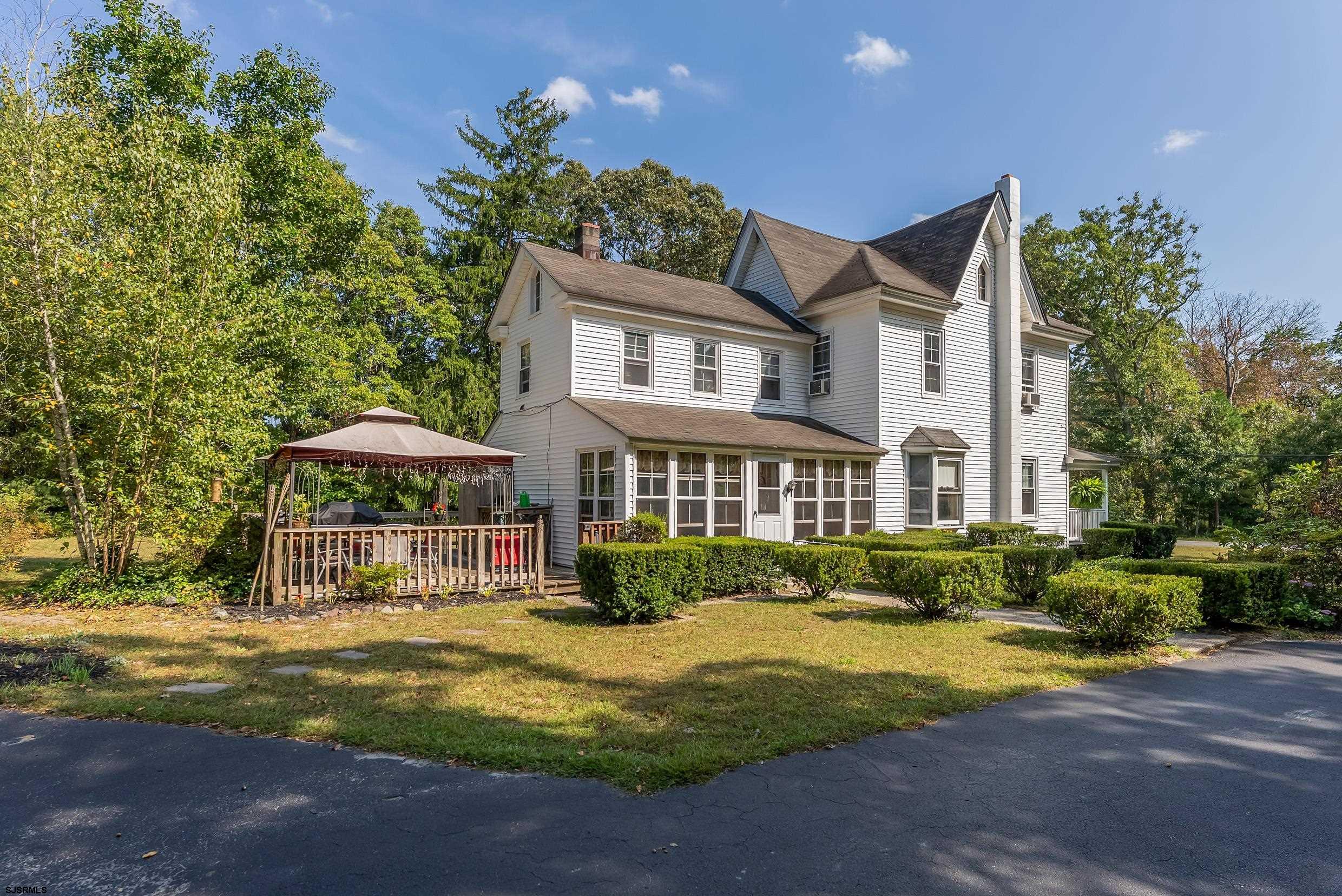 225 Chestnut Neck Road Port Republic, NJ 08241 - Photo 20 of 29 a front view of a house with a garden