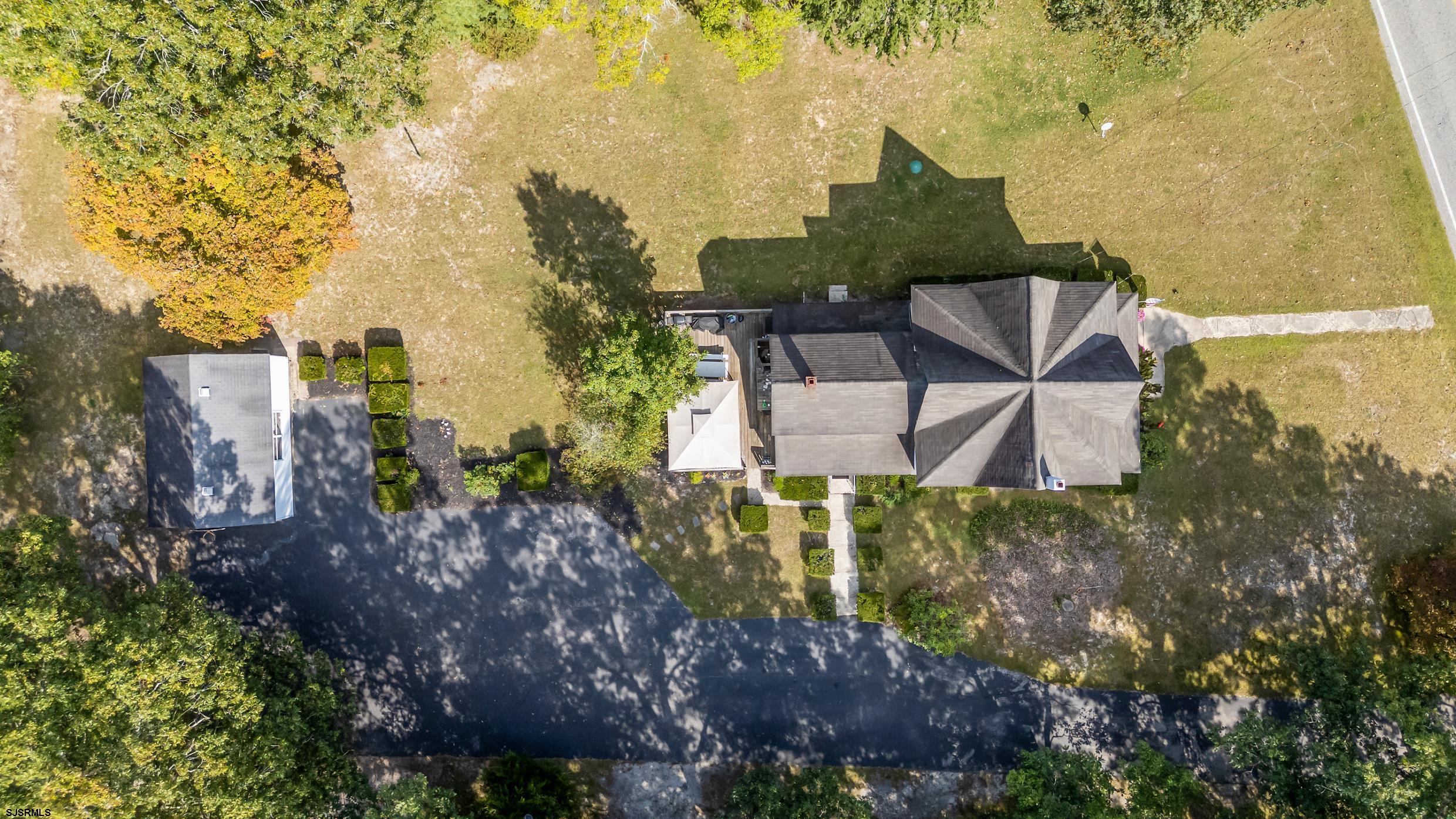 225 Chestnut Neck Road Port Republic, NJ 08241 - Photo 2 of 29 a view of a chairs and table in the garden