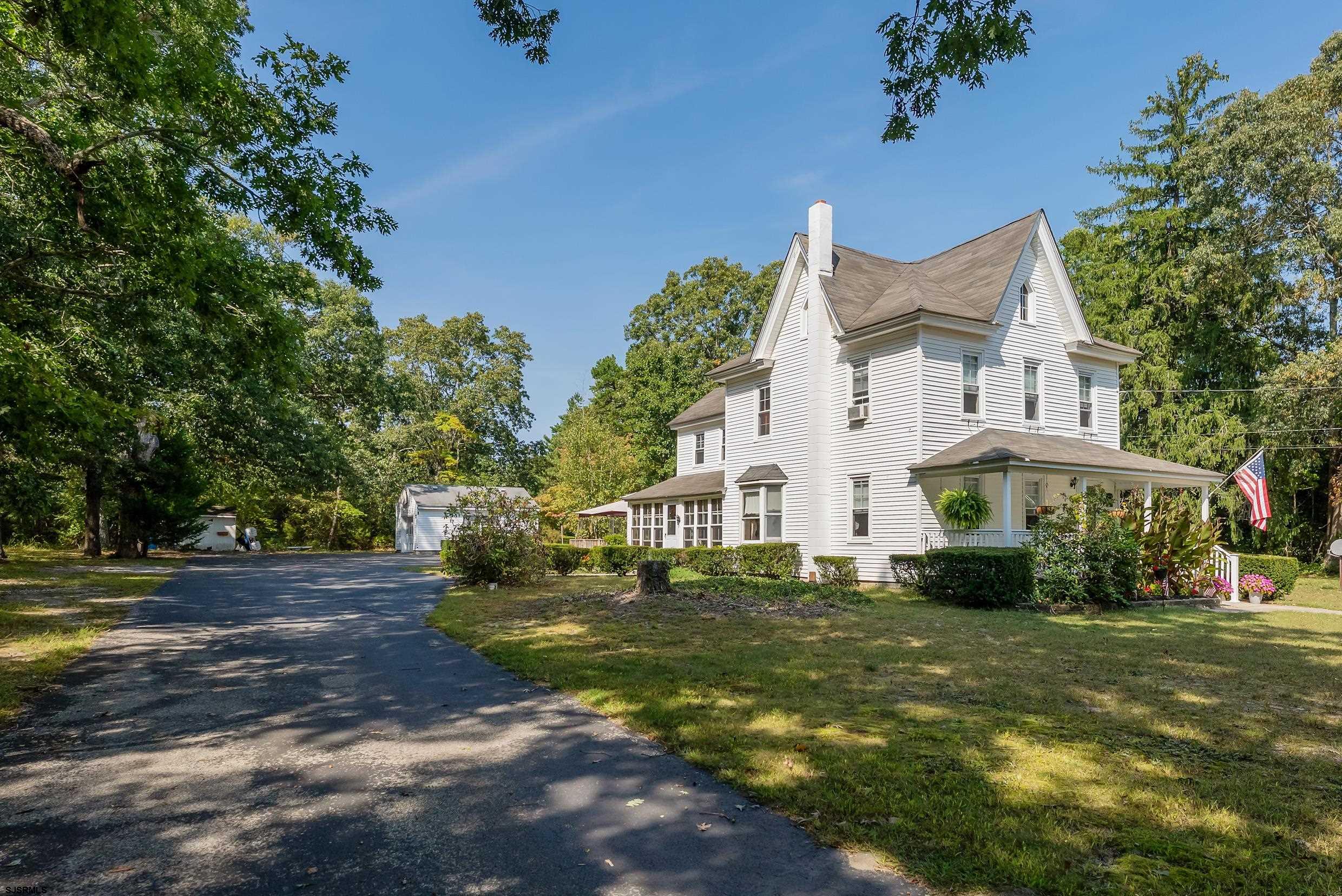 225 Chestnut Neck Road Port Republic, NJ 08241 - Photo 22 of 29 a front view of a house with a garden