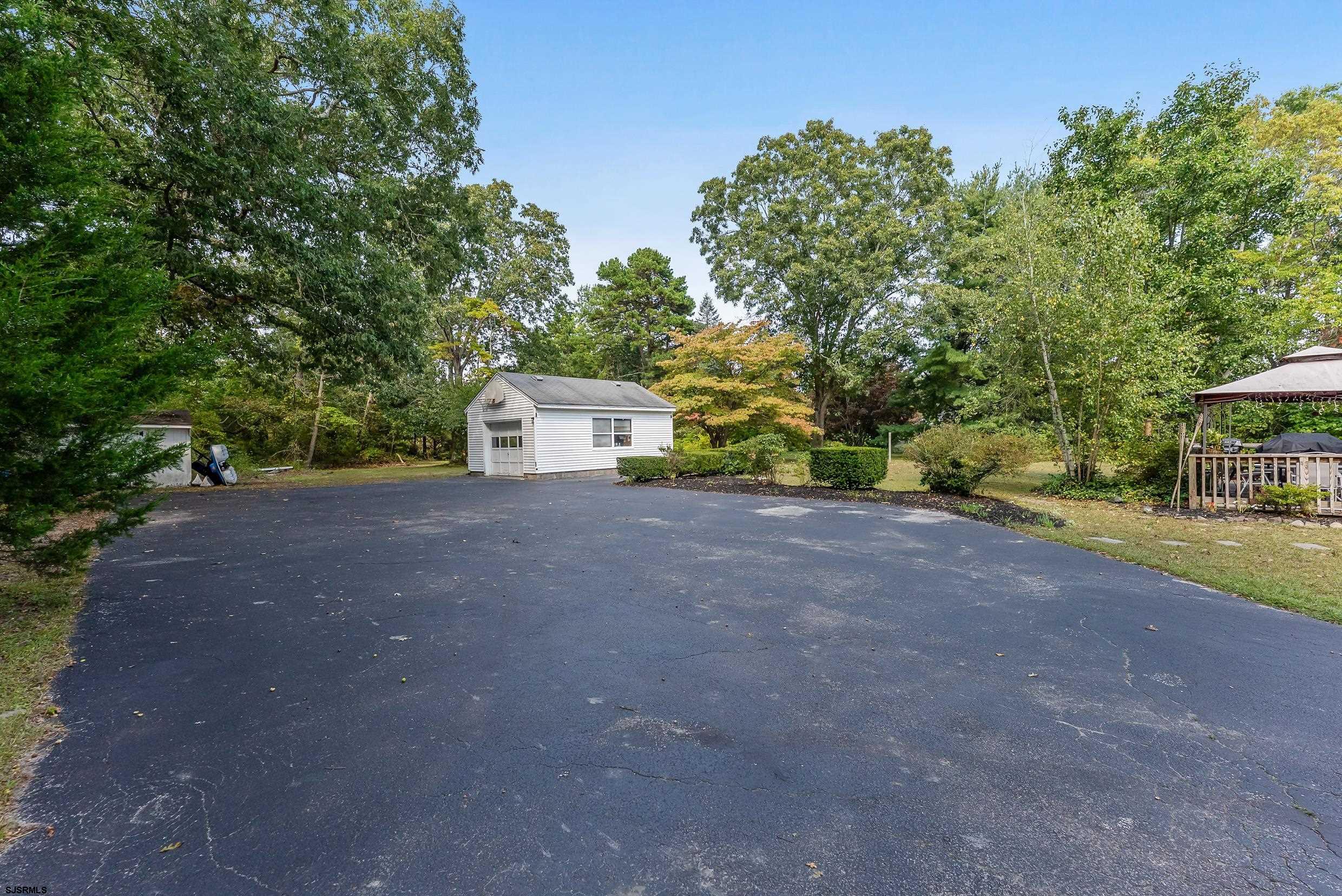 225 Chestnut Neck Road Port Republic, NJ 08241 - Photo 24 of 29 a view of a house with backyard and trees