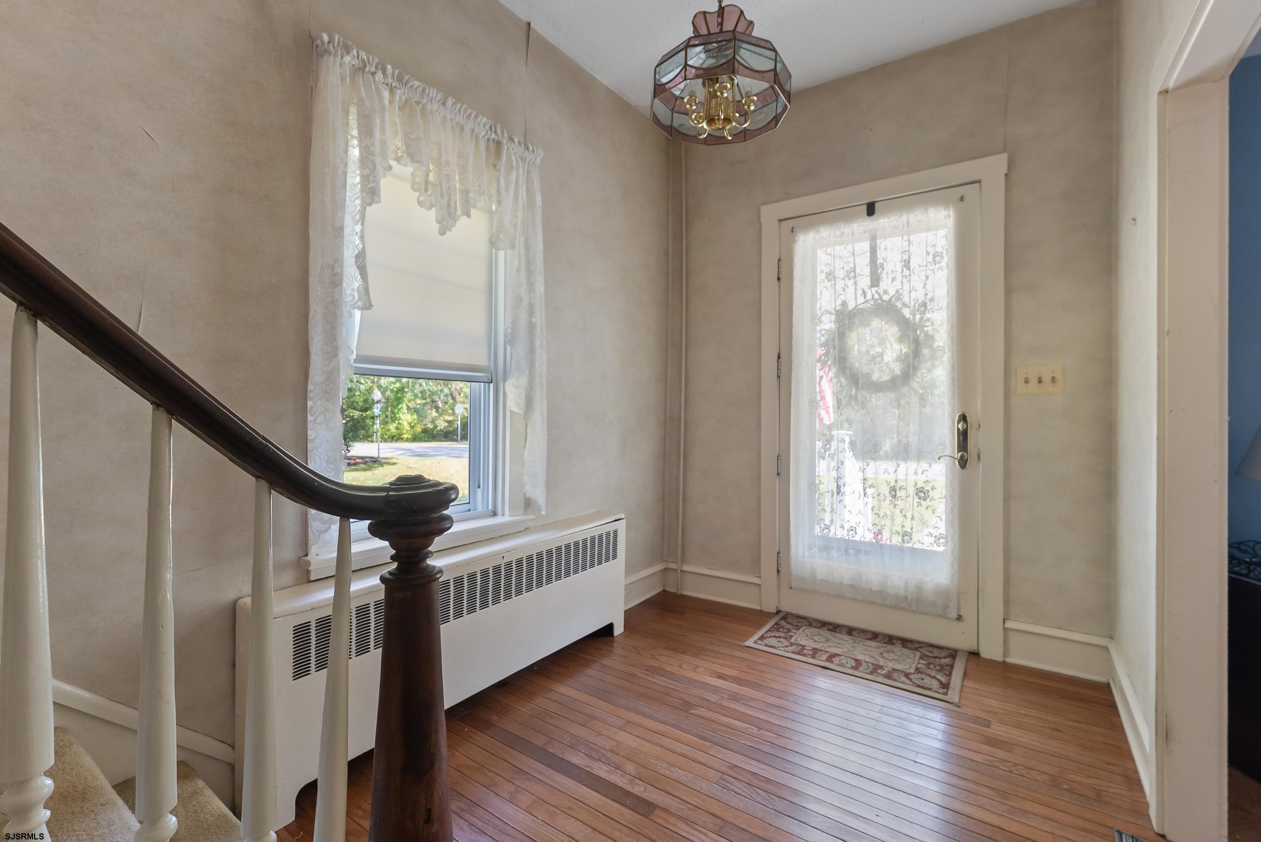 225 Chestnut Neck Road Port Republic, NJ 08241 - Photo 4 of 29 a view of an entryway with wooden floor and door
