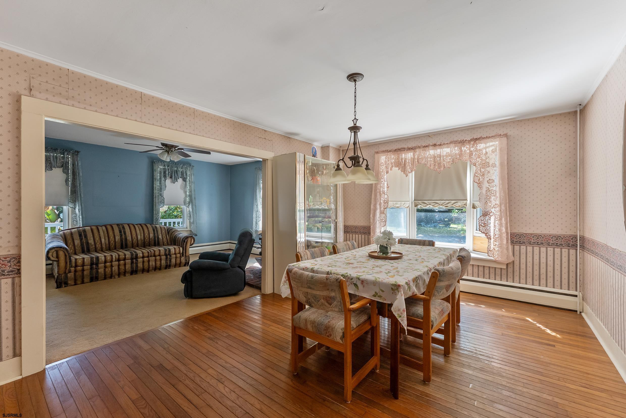 225 Chestnut Neck Road Port Republic, NJ 08241 - Photo 6 of 29 a view of a dining room with furniture window and wooden floor