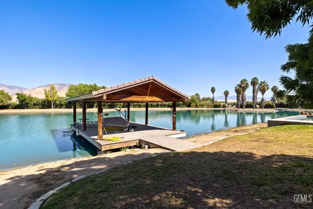 a view of a patio with swimming pool table and chairs