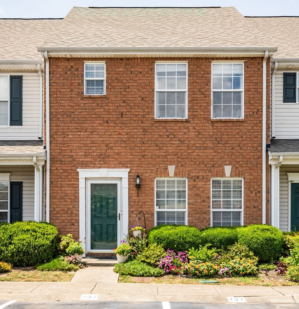 a front view of a house having yard