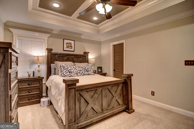 a bed room with bed and window