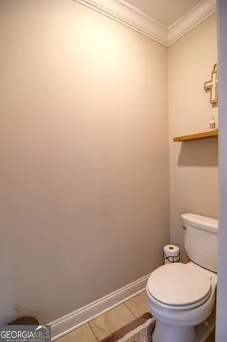 a bathroom with a toilet and a sink
