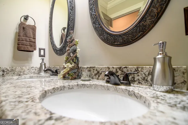 a bathroom with a sink a mirror and bathtub