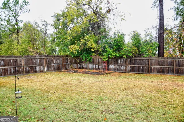 a swimming pool with wooden fence