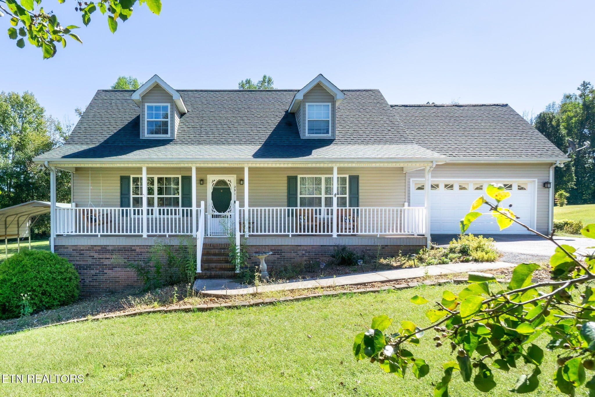 a view of a house with swimming pool and porch
