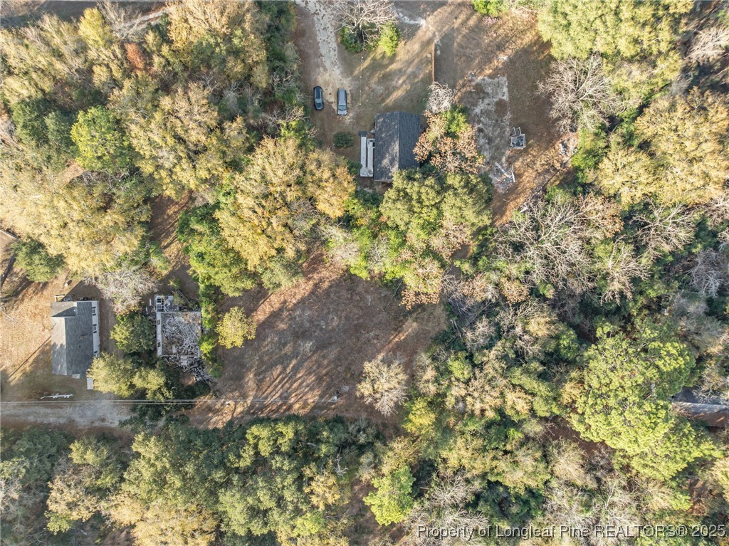 Doby Drive Raeford, NC 28376 - Photo 12 of 13 a backyard of a building with large trees