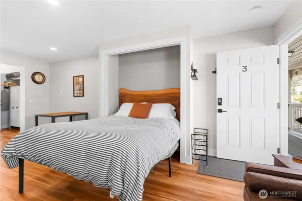 a bedroom with a bed and a couch