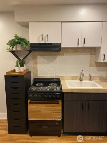 a bathroom with a sink and mirror