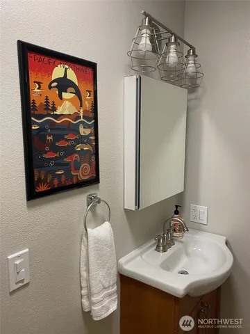 a view of a house with a wooden floor and flower pot