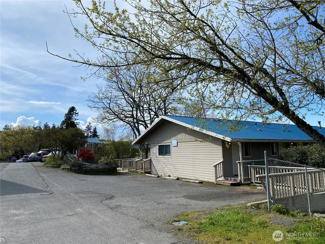 a view of a patio with table and chairs and couches