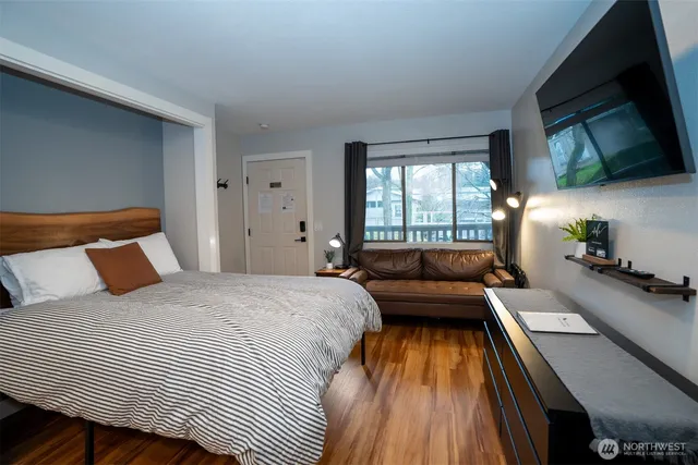 a bedroom with a bed and a couch