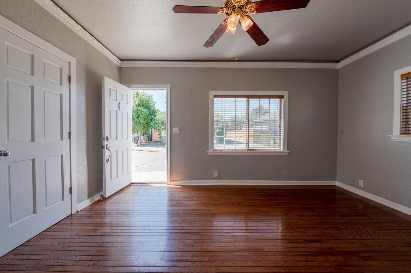 271 Everett Avenue Campbell, CA 95008 - Photo 7 of 32 a view of an empty room with wooden floor and a window