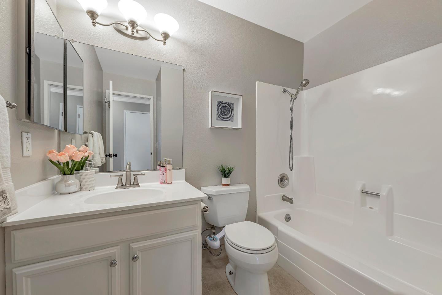 47 Dot Avenue, Unit A Campbell, CA 95008 - Photo 26 of 31 a bathroom with a sink a toilet and shower
