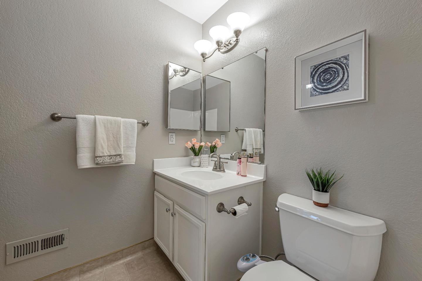 47 Dot Avenue, Unit A Campbell, CA 95008 - Photo 27 of 31 a bathroom with a toilet a sink and mirror