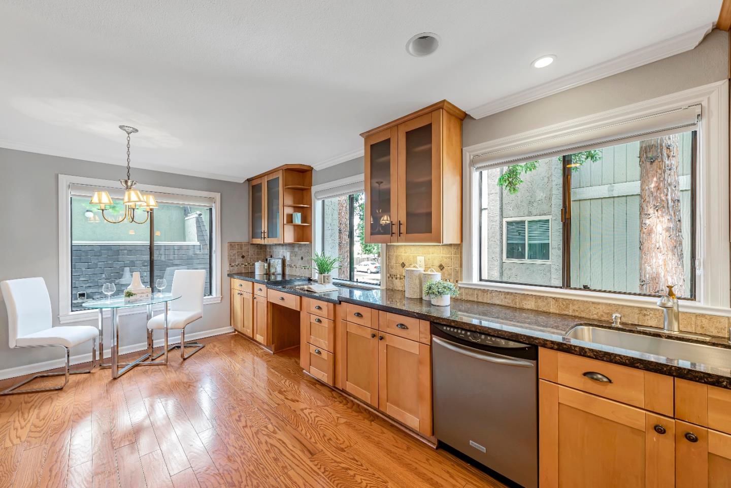 47 Dot Avenue, Unit A Campbell, CA 95008 - Photo 8 of 31 a large kitchen with kitchen island a large window a sink and stainless steel appliances
