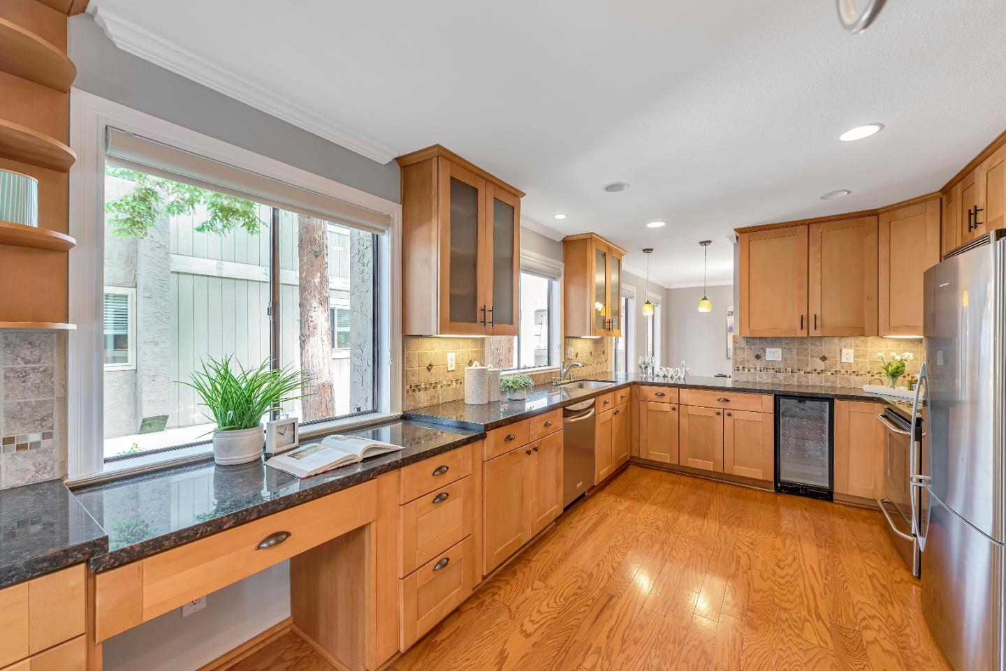 47 Dot Avenue, Unit A Campbell, CA 95008 - Photo 9 of 31 a large kitchen with a large window and stainless steel appliances