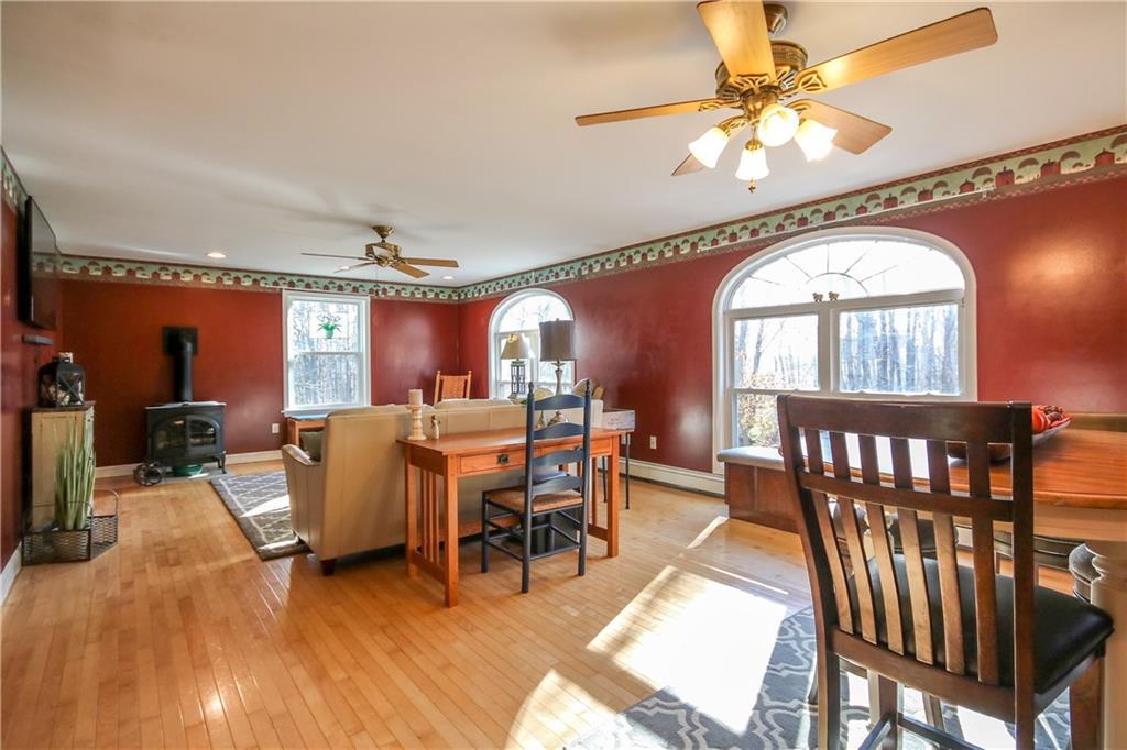 83 Blanchard Road Cumberland, ME 04021 - Photo 16 of 35 Great room with gas stove. Sunny and...