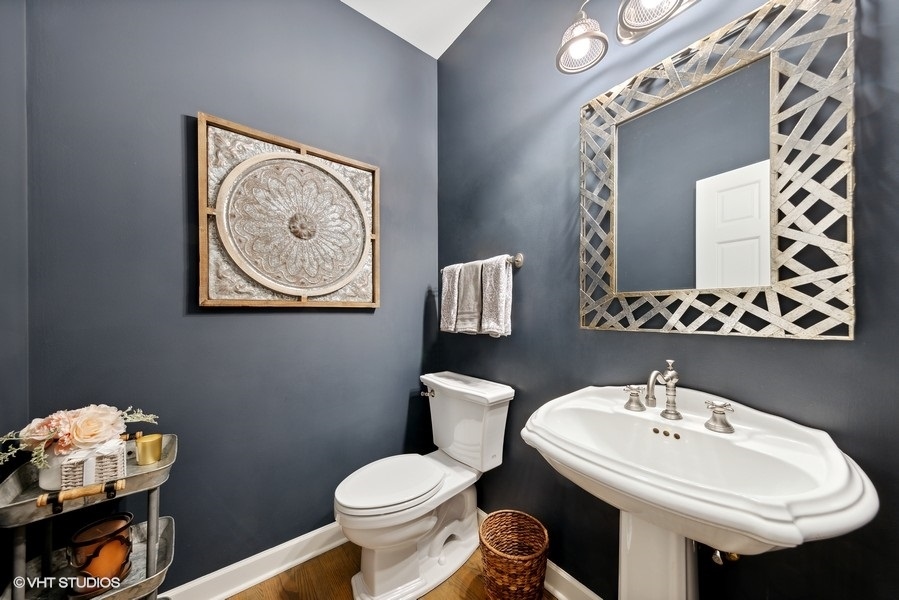 134 West 59th Street Burr Ridge, IL 60527 - Photo 16 of 41 a bathroom with a sink and a mirror