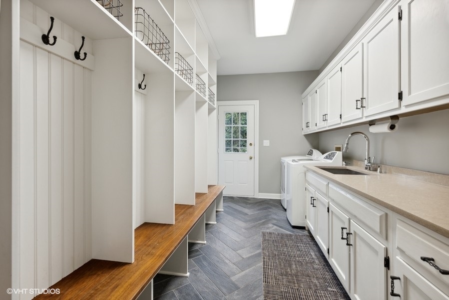 134 West 59th Street Burr Ridge, IL 60527 - Photo 17 of 41 a kitchen with cabinets a sink and wooden floor