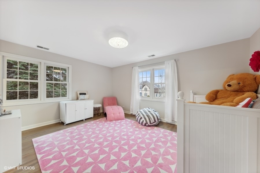 134 West 59th Street Burr Ridge, IL 60527 - Photo 25 of 41 a bedroom with furniture and window