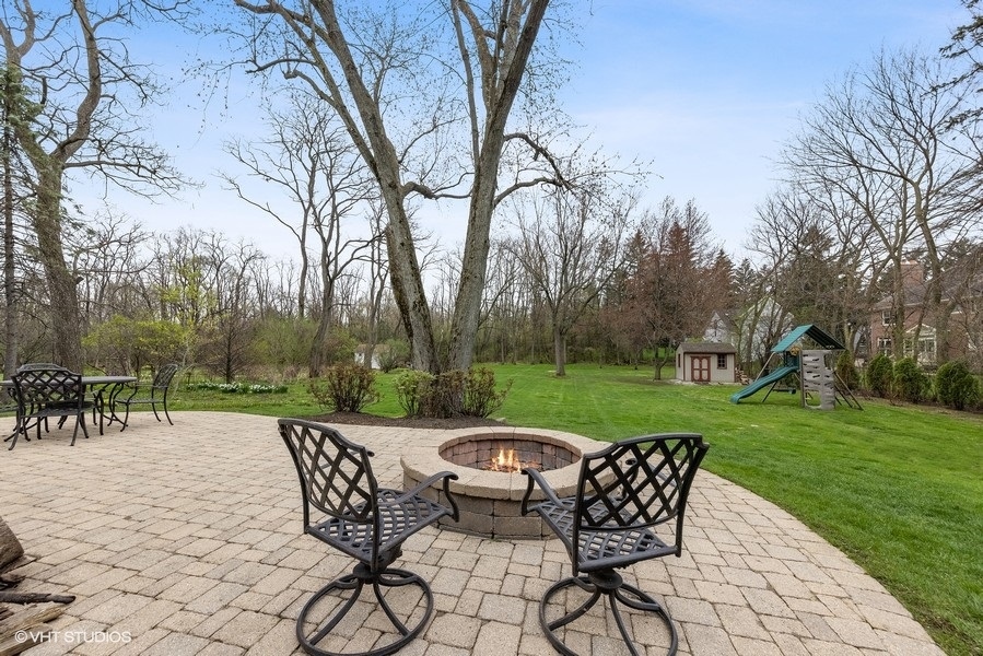 134 West 59th Street Burr Ridge, IL 60527 - Photo 34 of 41 a view of a chairs and table in the garden