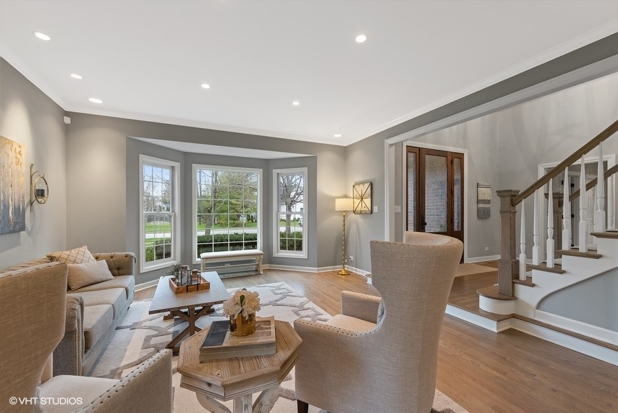 134 West 59th Street Burr Ridge, IL 60527 - Photo 5 of 41 a living room with furniture and large windows