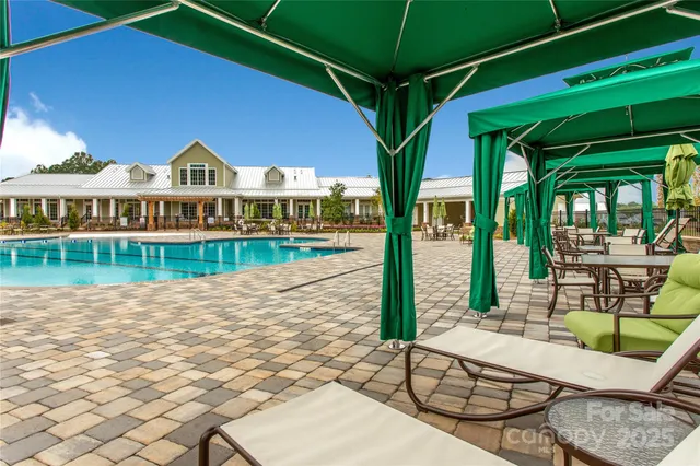 a aerial view of a yard tables and chairs in the patio