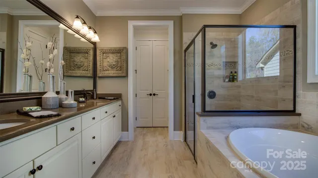 a living room with furniture kitchen view and large windows