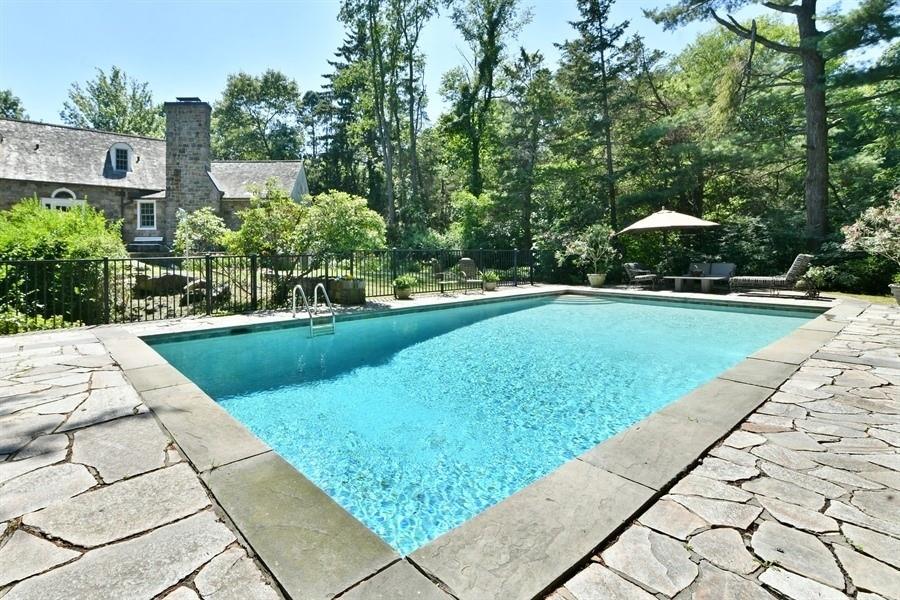 a view of a swimming pool with a garden