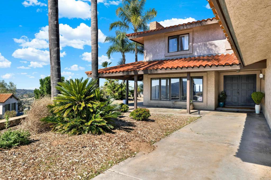 29345 Wilkes Road Valley Center, CA 92082 - Photo 19 of 63 a front view of a house with garden