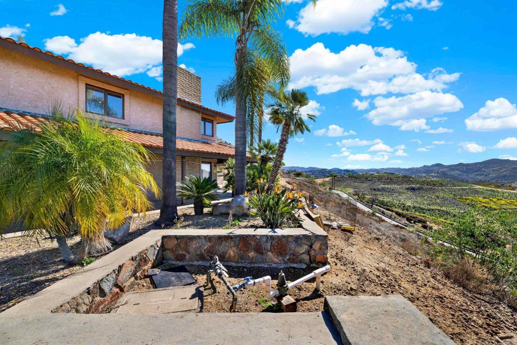 29345 Wilkes Road Valley Center, CA 92082 - Photo 21 of 63 a view of a house with a yard