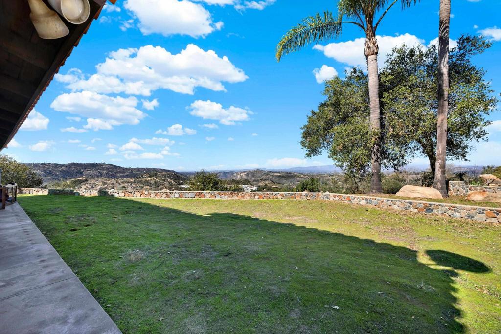 29345 Wilkes Road Valley Center, CA 92082 - Photo 22 of 63 a view of a house with a yard