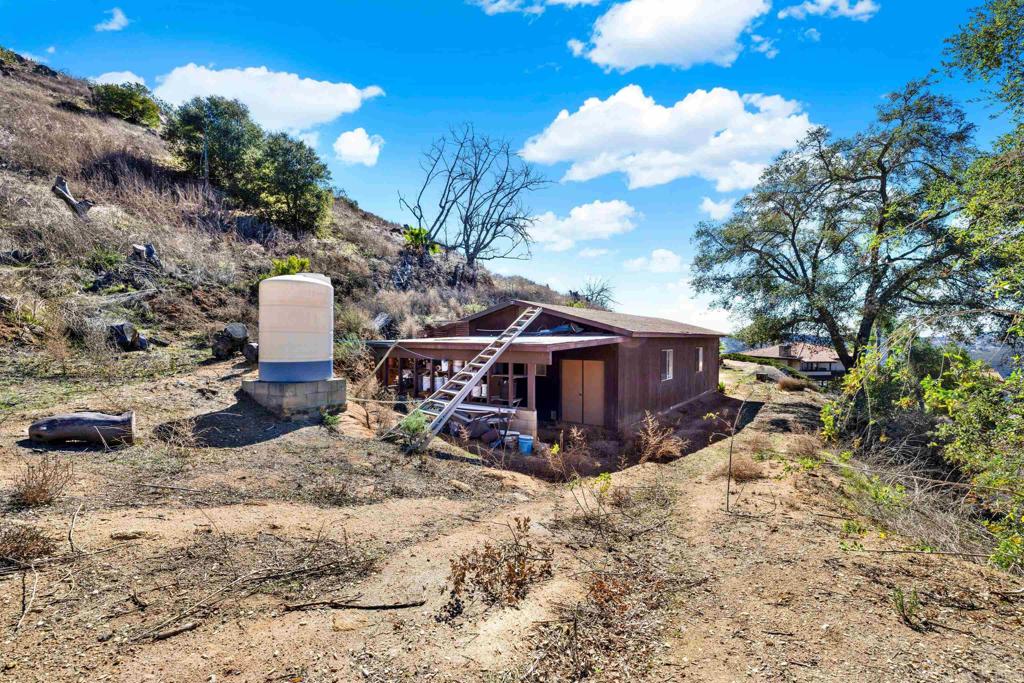 29345 Wilkes Road Valley Center, CA 92082 - Photo 29 of 63 a view of a house with a yard