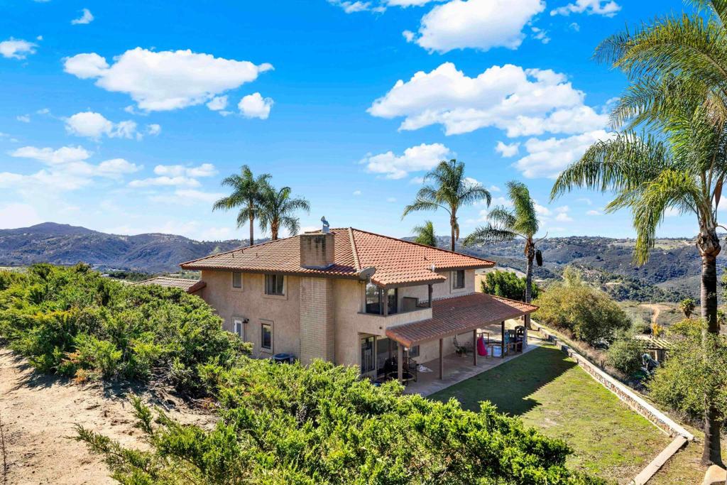 29345 Wilkes Road Valley Center, CA 92082 - Photo 32 of 63 a view of a house with a garden
