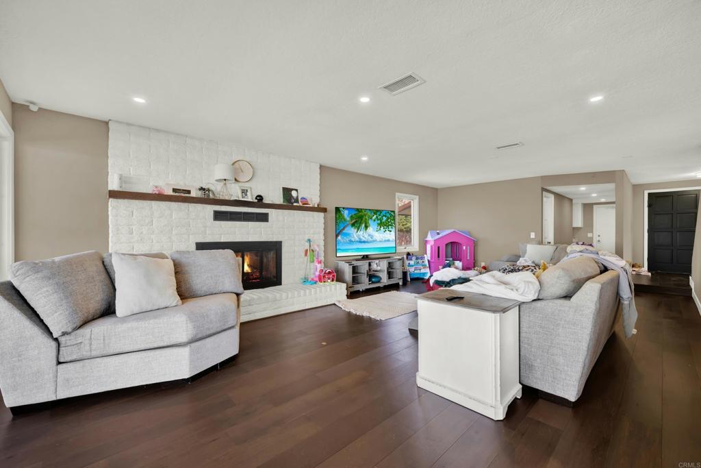 29345 Wilkes Road Valley Center, CA 92082 - Photo 39 of 63 a living room with furniture and a fireplace