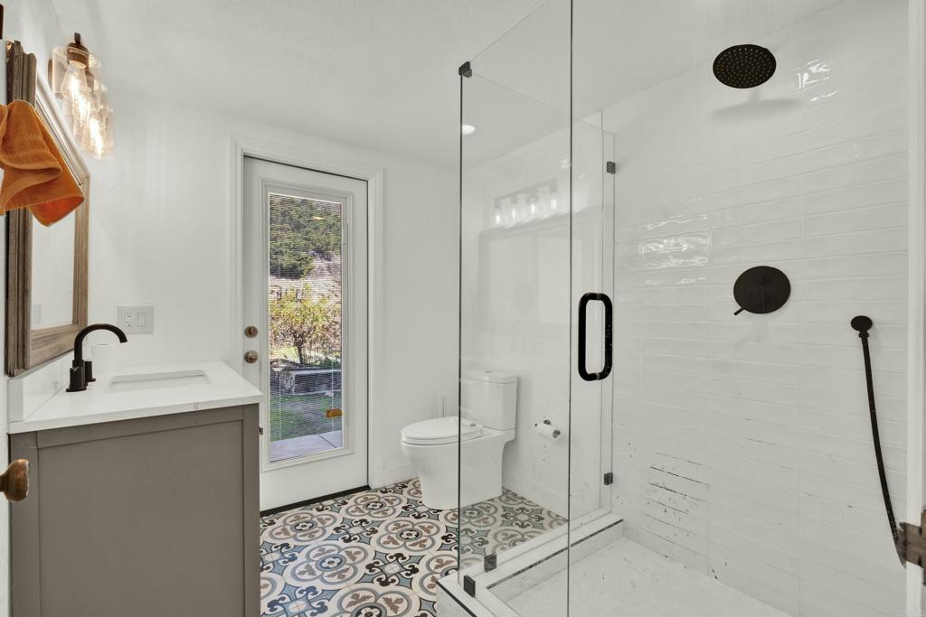 29345 Wilkes Road Valley Center, CA 92082 - Photo 40 of 63 a bathroom with a sink toilet and shower