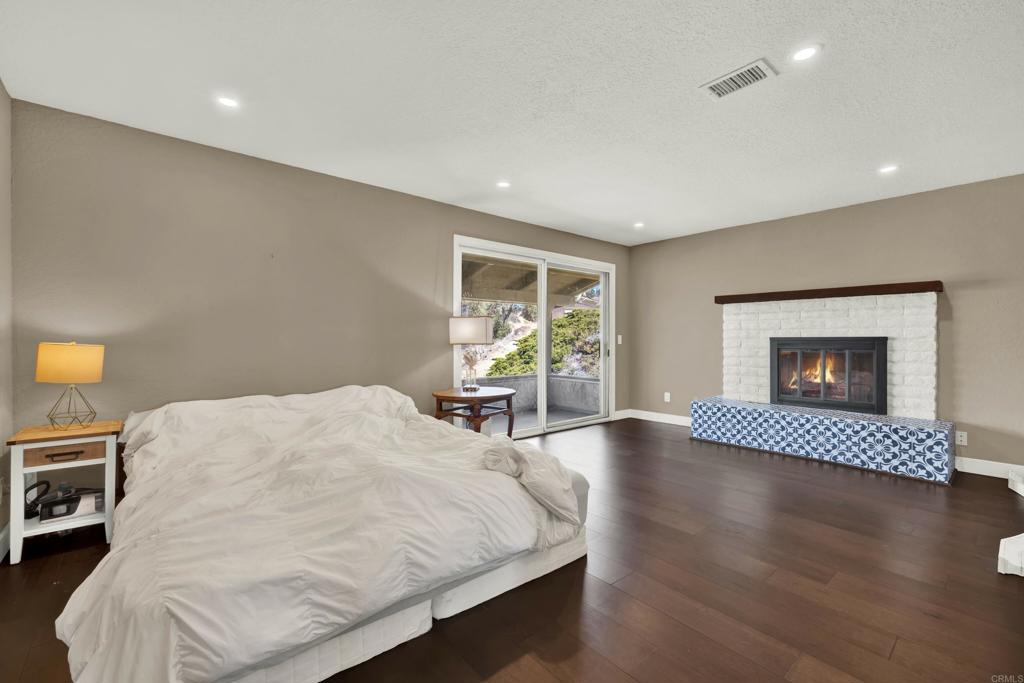 29345 Wilkes Road Valley Center, CA 92082 - Photo 41 of 63 a living room with furniture and a fireplace