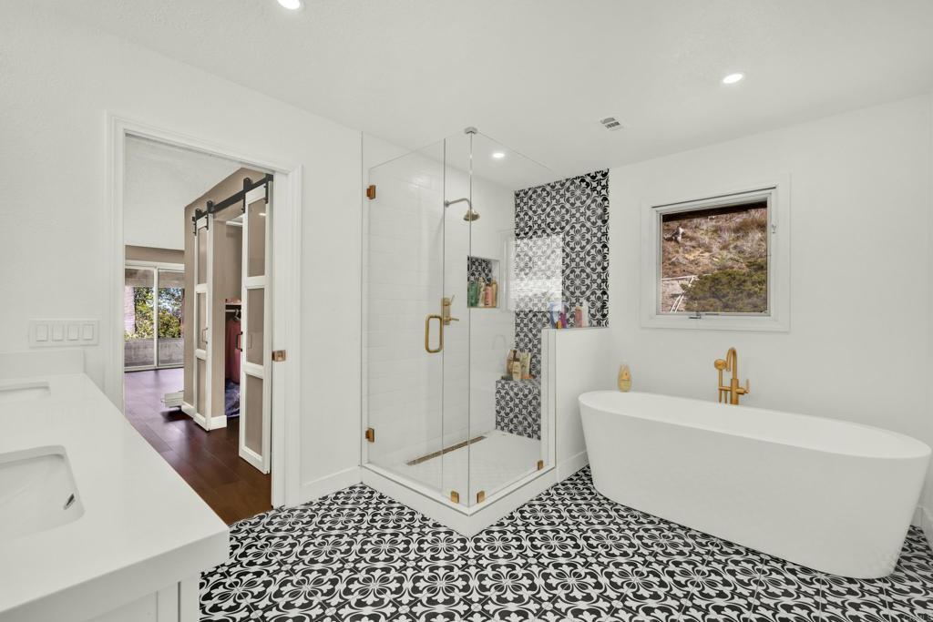 29345 Wilkes Road Valley Center, CA 92082 - Photo 45 of 63 a bathroom with a bathtub a toilet and a shower