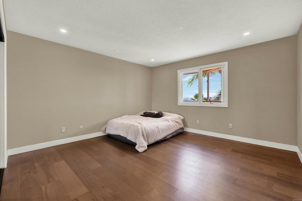 29345 Wilkes Road Valley Center, CA 92082 - Photo 47 of 63 a bed room with a bed and a window