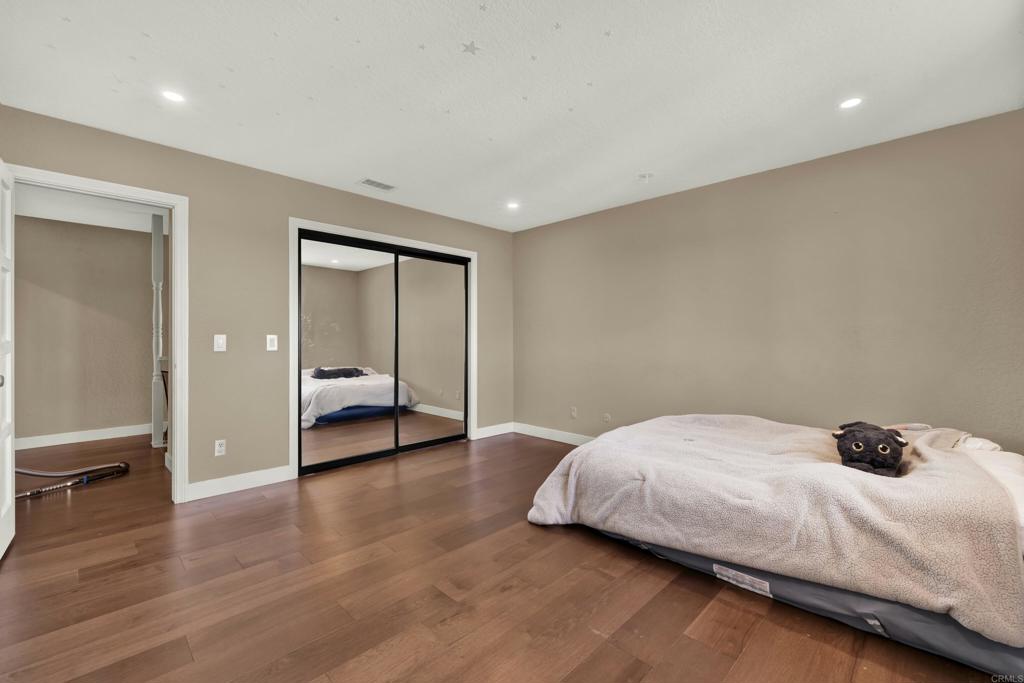 29345 Wilkes Road Valley Center, CA 92082 - Photo 48 of 63 a bedroom with a bed and a window