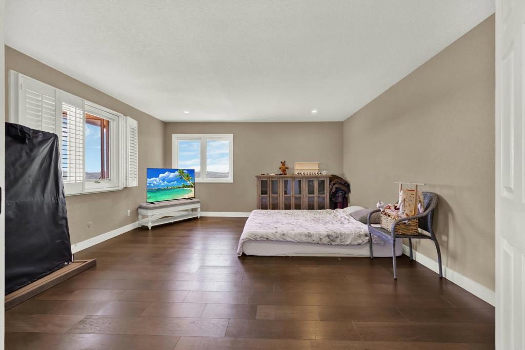 29345 Wilkes Road Valley Center, CA 92082 - Photo 49 of 63 a bedroom with furniture and a window