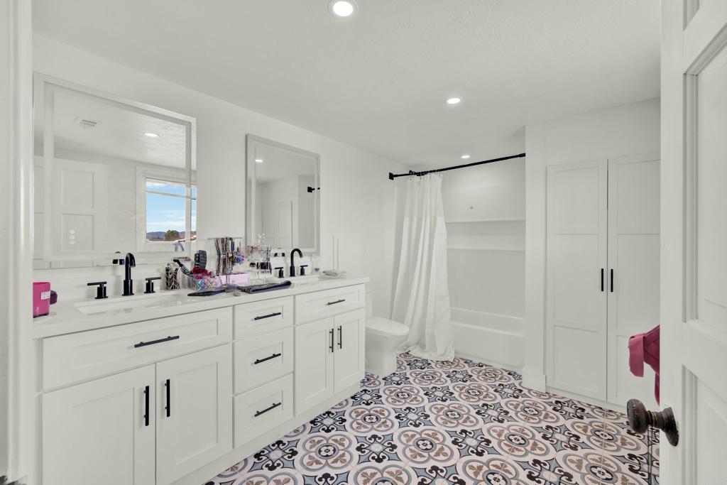 29345 Wilkes Road Valley Center, CA 92082 - Photo 51 of 63 a bathroom with a sink and a mirror