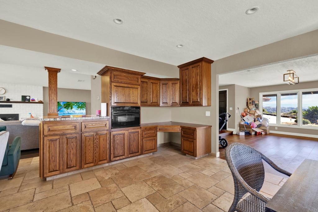 29345 Wilkes Road Valley Center, CA 92082 - Photo 54 of 63 a large kitchen with cabinets and wooden floor