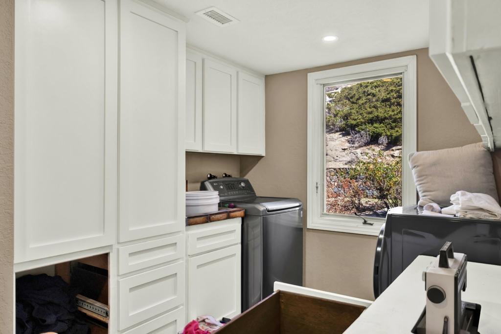 29345 Wilkes Road Valley Center, CA 92082 - Photo 62 of 63 a kitchen with a window a sink and a refrigerator