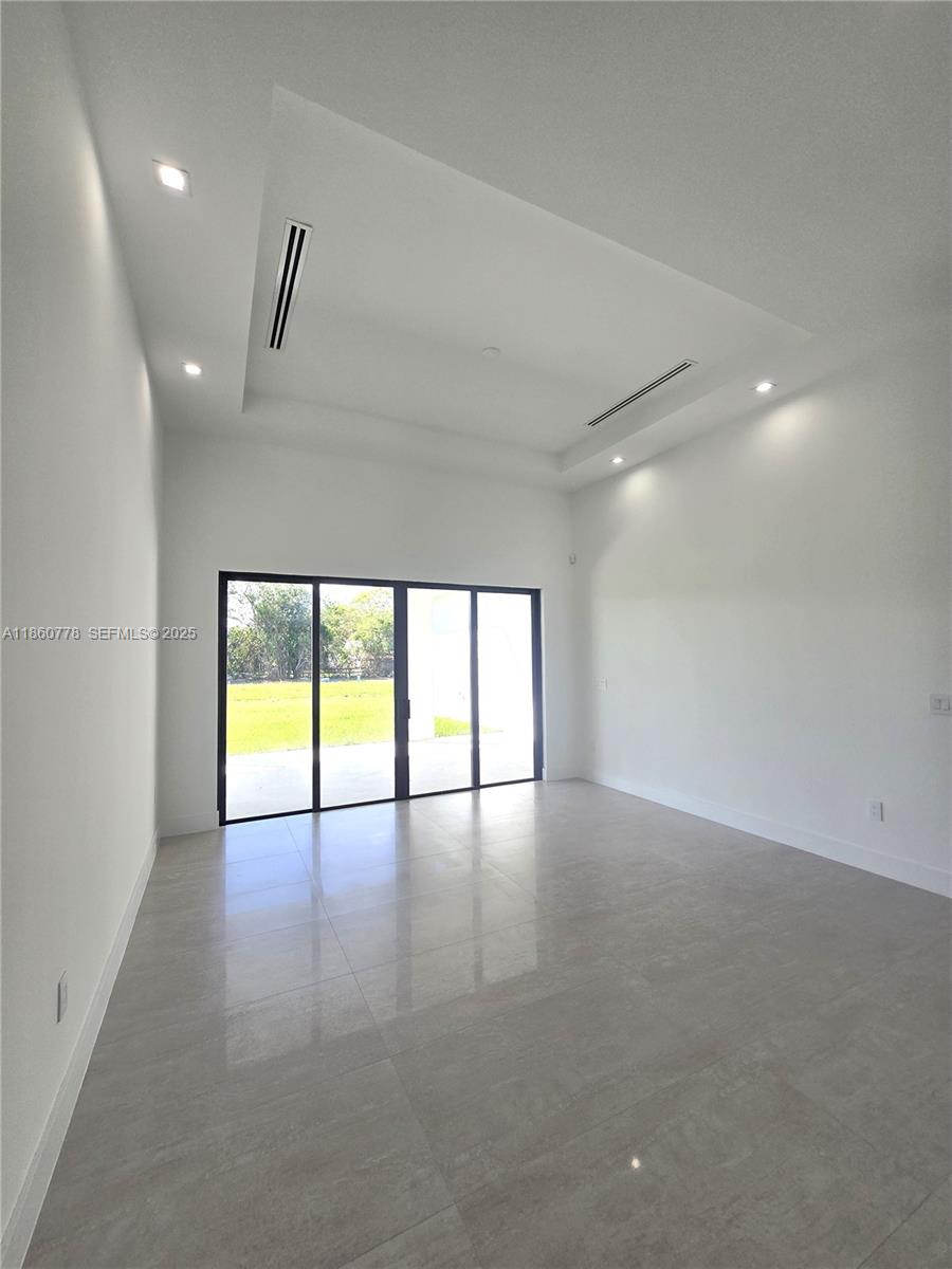 23840 Southwest 209th Place Homestead, FL 33031 - Photo 30 of 89 a view of an empty room with a window