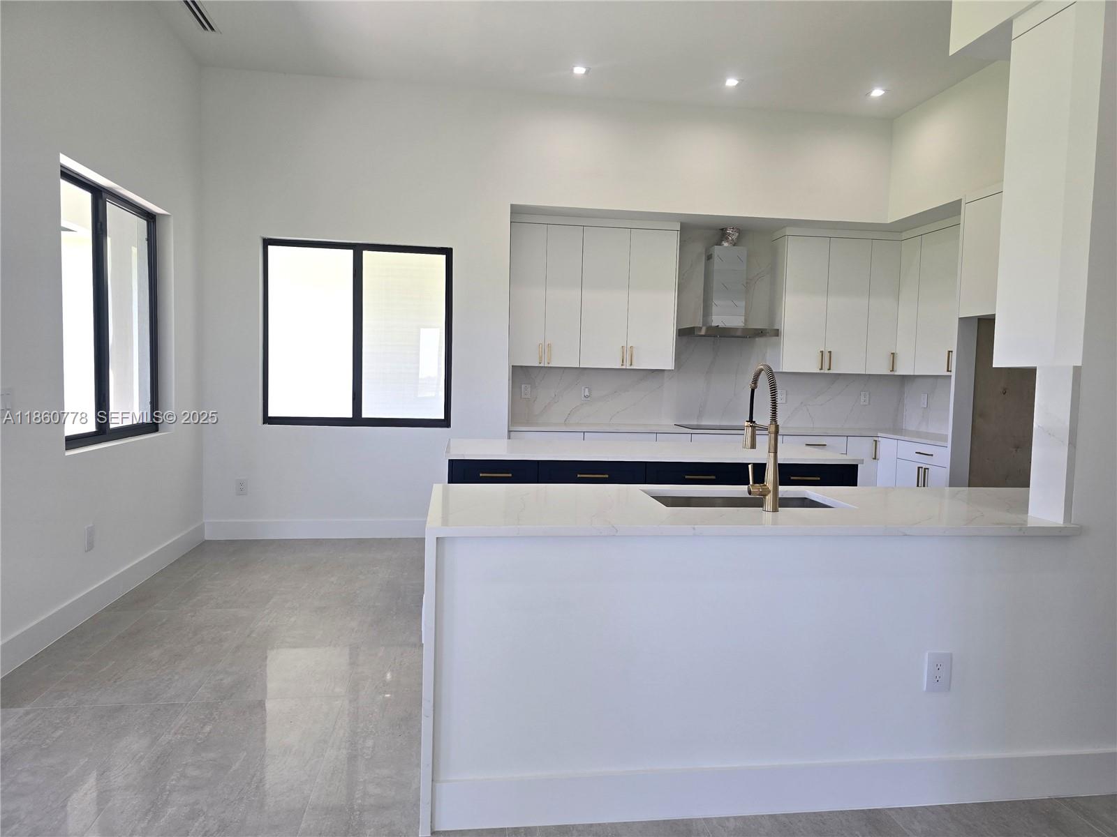 23840 Southwest 209th Place Homestead, FL 33031 - Photo 39 of 89 a kitchen with stainless steel appliances granite countertop a sink a stove and a refrigerator